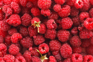 fresh red ripe raspberry closeup background top view