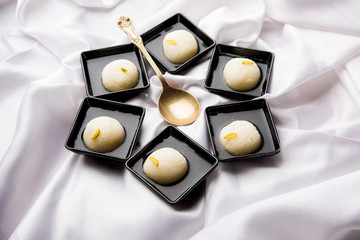 Indian Rasgulla or Rosogulla dessert/sweet served in a bowl. selective focus