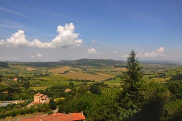 Large fields and distant hills in the sunlight. Photo from a small town in Italy.
