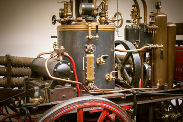 Old mechanism toned photo.  Retro style machinery, gear, metal cogwheels, nuts and bolts.