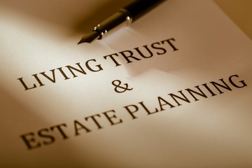 Fountain Pen Lying on the "Living Trust and Estate Planning" -