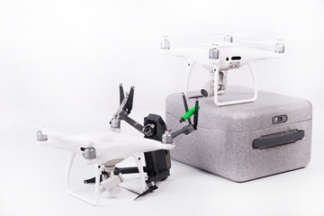 Flying drones with video camera on a white background. Repair quadcopter theme