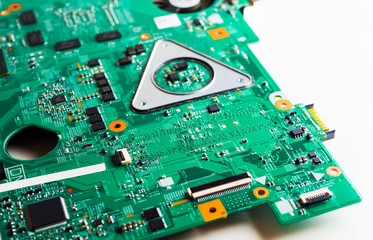 Detail of an electronic printed circuit board with many electrical components