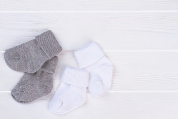 Collection of white and grey socks.