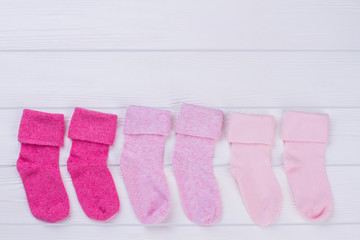Colourful pairs of wool and cotton pink socks.
