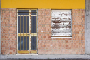 The front door and windows at abandoned building