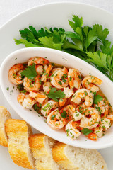 garlic prawns with bread and parsley