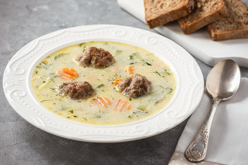 Creamy vegetable soup with beef meatballs.