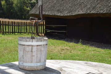 Naklejka premium an old bucket for getting water from a deep well