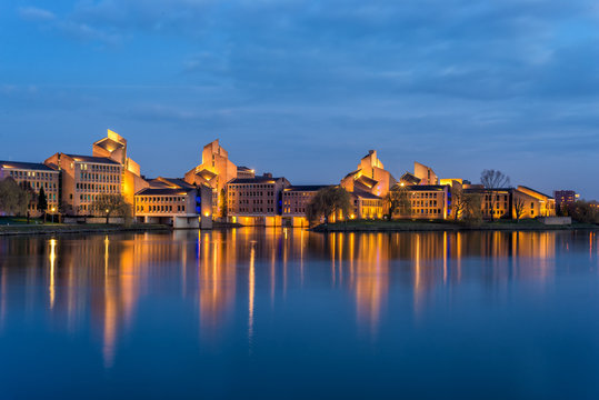 The Gouvernement building along the Maas river in Maastricht, The Netherlands during the evening blue hour