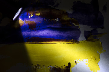 Lantern illuminating abstract acrylic painting, yellow, blue, purple