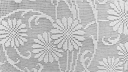 Fragment of crocheted old tablecloth. Handmade, knitting. A sample of knitting.
