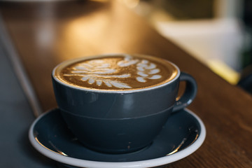 Cup of coffee with latte art, morning drink