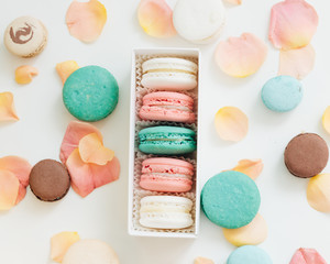 Composition of delicious macaroons in gift box, sweet dessert