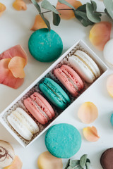 Composition of delicious macaroons in gift box, sweet dessert