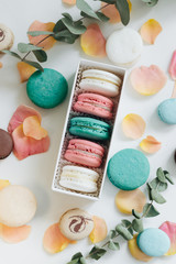 Composition of delicious macaroons in gift box, sweet dessert