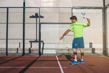 Sportsman playing padel game