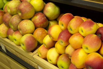 Apples stacked in a wooden box. 
