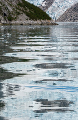 Northwest Glacier reflected in bay waters
