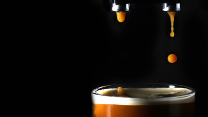 Droplet of coffee splashing in a mug