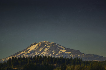 mountain at dusk with stars