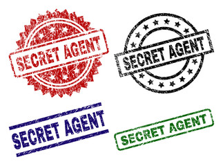 SECRET AGENT seal stamps with distress style. Black, green,red,blue vector rubber prints of SECRET AGENT text with unclean style. Rubber seals with round, rectangle, rosette shapes.