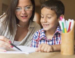 Mother and son coloring together