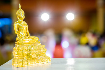 Gold buddha statue on the table. symbol of buddhism religion in thai wedding ceremony. image for...