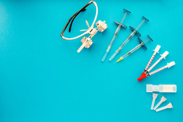 Flat lay of medical instruments on blue background. Mock up health care medical background.