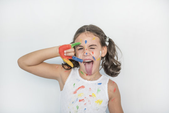 little girl smeared with paints