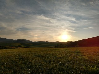 Fototapeta na wymiar Sunrise and sunset over the hills and town. Slovakia 