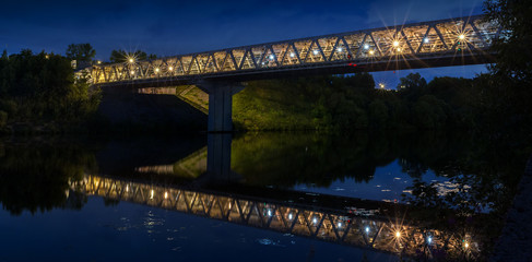 Moscow region. July 6, 2018. Station Myakinino. Night view of the metro bridge and its reflection in the Moscow River