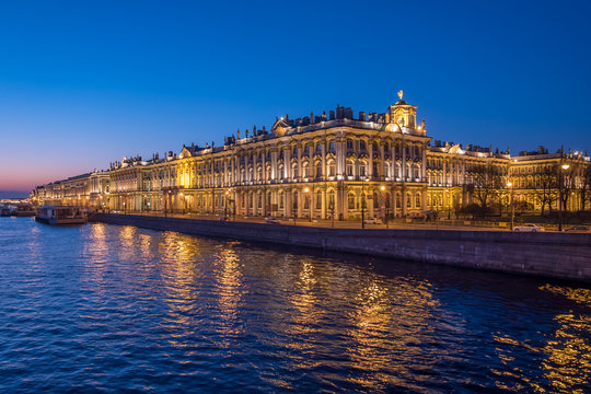 Night view of Hermitage palace and Neva river in Saint Petersburg, Russia.