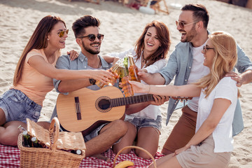 Friends having fun on the beach
