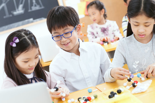 Elementary school students use computers in the classroom