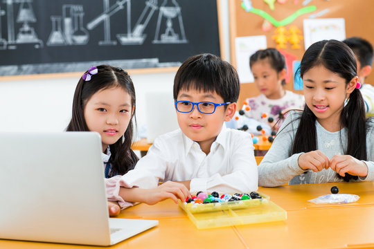 Elementary school students use computers in the classroom