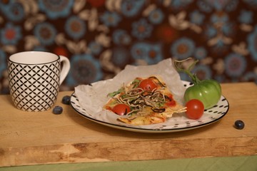 pizza slice with tomato