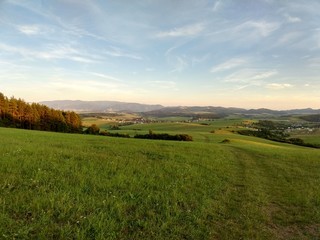 Obraz premium Sunrise and sunset over the hills and town. Slovakia 