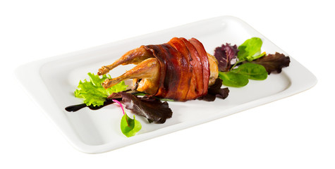 Photography of plate with baked in bacon quail with balsamic sauce
