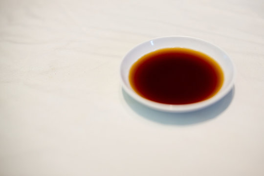 Japan soy sauce, Soyu in white bowl. Color of food, fill up tasty concept.sauce for japanese food, sushi, sashimi and teppanyaki.