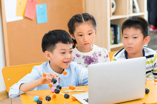 Elementary school students use computers in the classroom