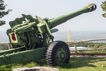 Cannon gun military vehicle with landscape background