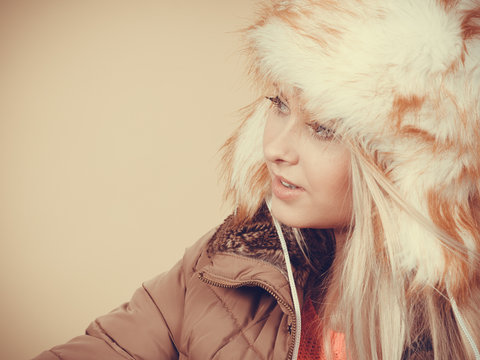 Blonde woman in winter furry hat