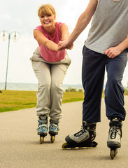 roller skater couple skating outdoor