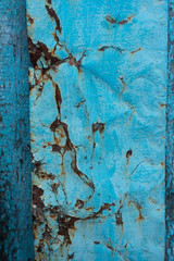 Rusty old vintage iron texture with flaky blue paint