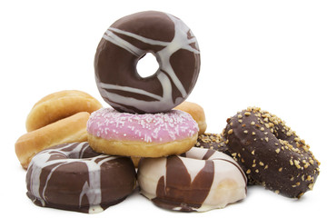 varied donuts stacked and insulated in white background