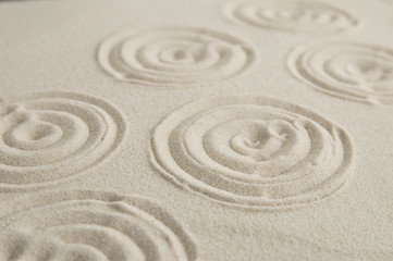 Zen drawing on white sand. Concept of harmony, balance and meditation, spa, massage, relax