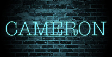 first name cameron in blue neon on brick wall