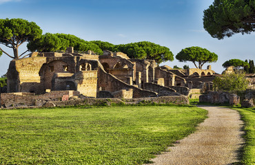 Fototapeta na wymiar Roman ruins landscape in Ancient Ostia with the tenements of Serapide and the adjacent Seven wise men's spa and the Arrighi's tenement
