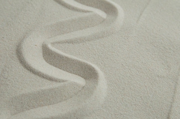 Obraz premium Zen drawing on white sand. Concept of harmony, balance and meditation, spa, massage, relax